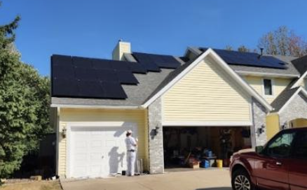 Residential solar panel installation by Wolf River Electric on a suburban home, enhancing energy savings and sustainability.